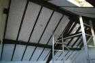 continuing the insulation in the attic loft insulation les guis virlet puy de dome france stand alone renewable energy farm solar panels wind turbines copyright free photo royalty free photo